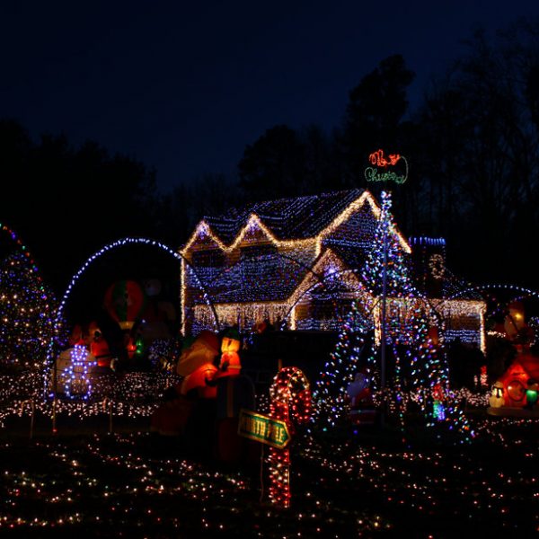 A Home decorated and lighted with 650,000 lights and over 60 inflatables for Christmas and for New Year Eve at Night in Virginia